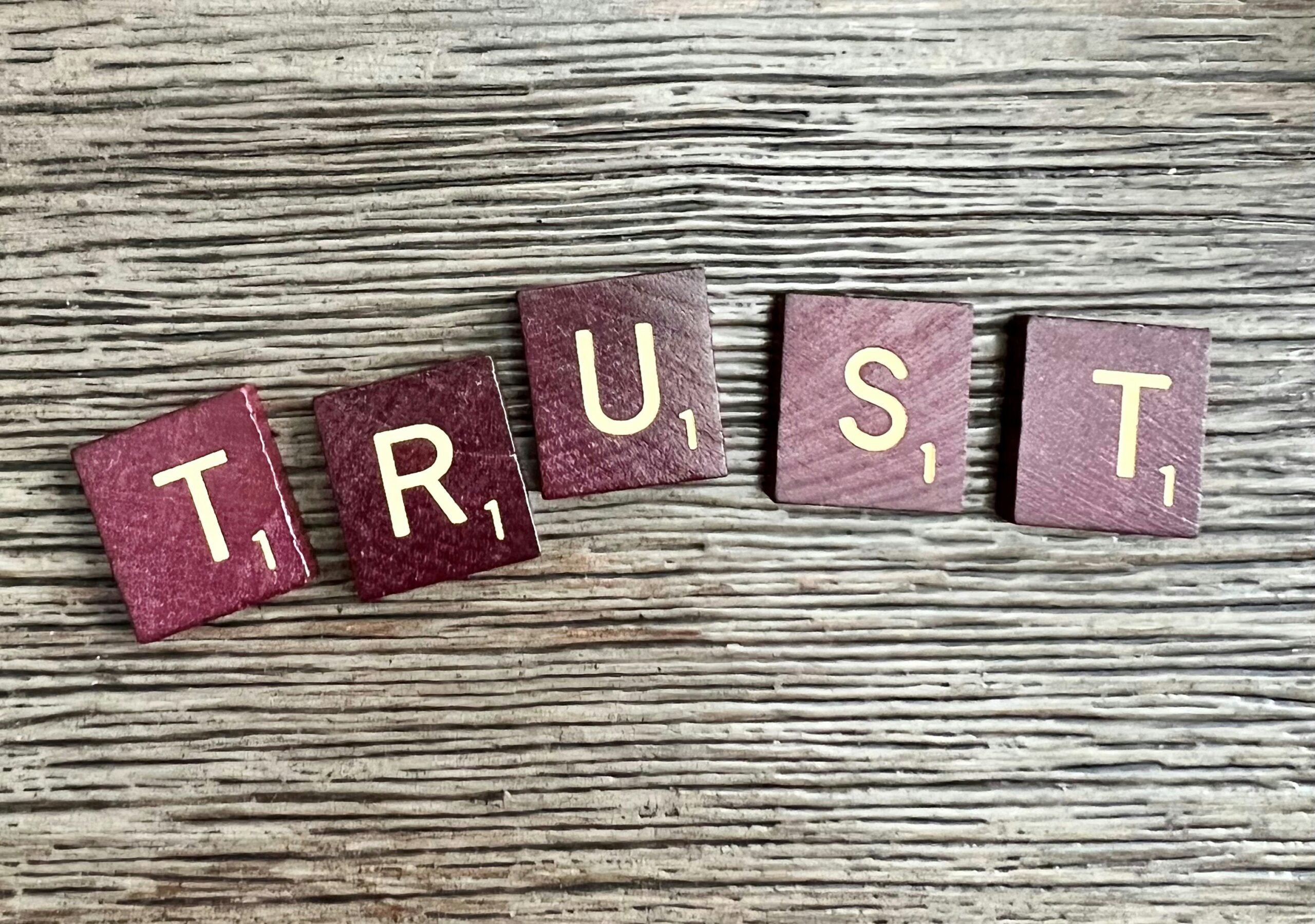 Five Scrabble tiles spell out the word 