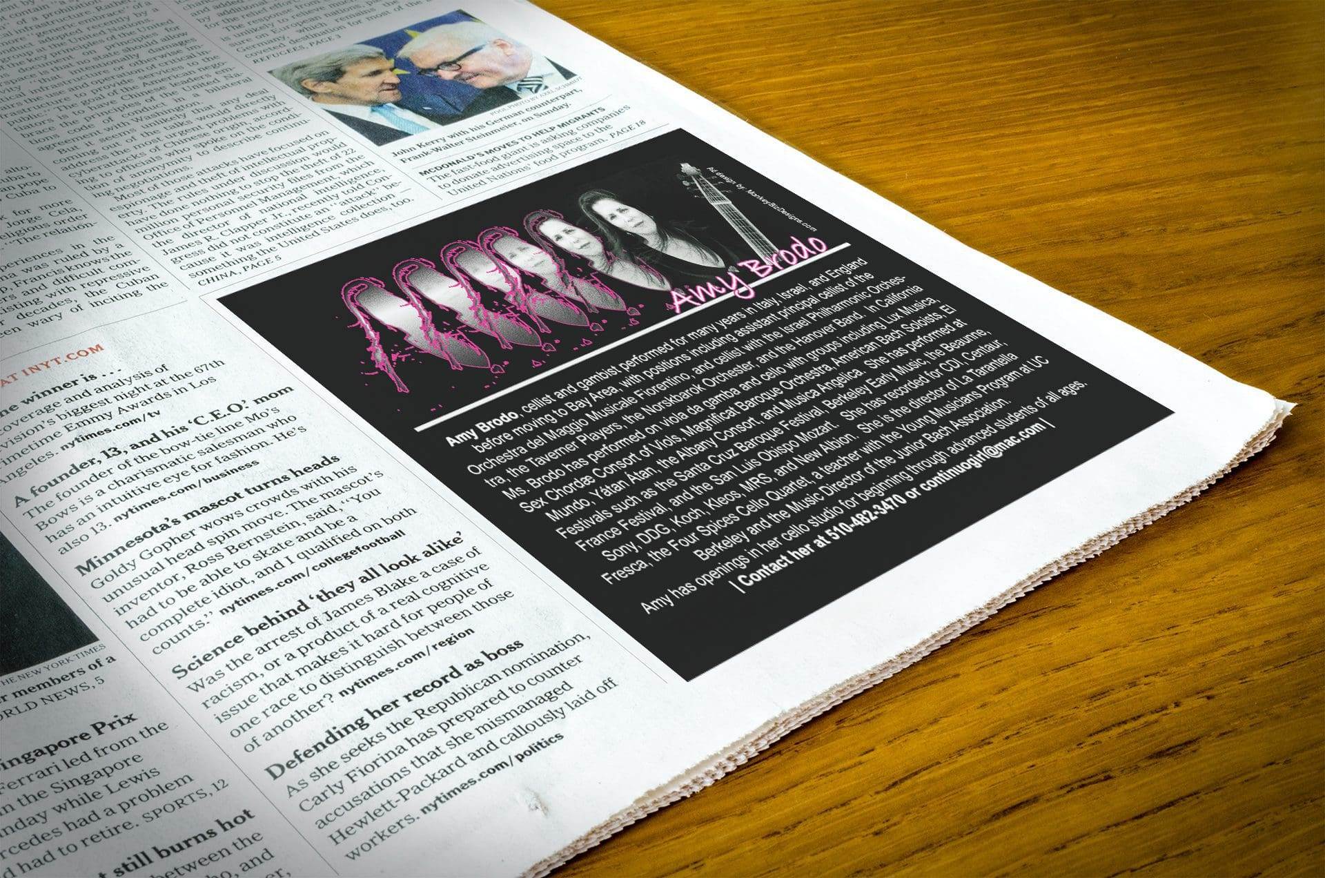 Portfolio A newspaper rests on a wooden table, featuring a black and pink advertisement for the band Amy Bado, with a photo of the band members and text about their music by a professional website design company.All-inclusive Website Design Services